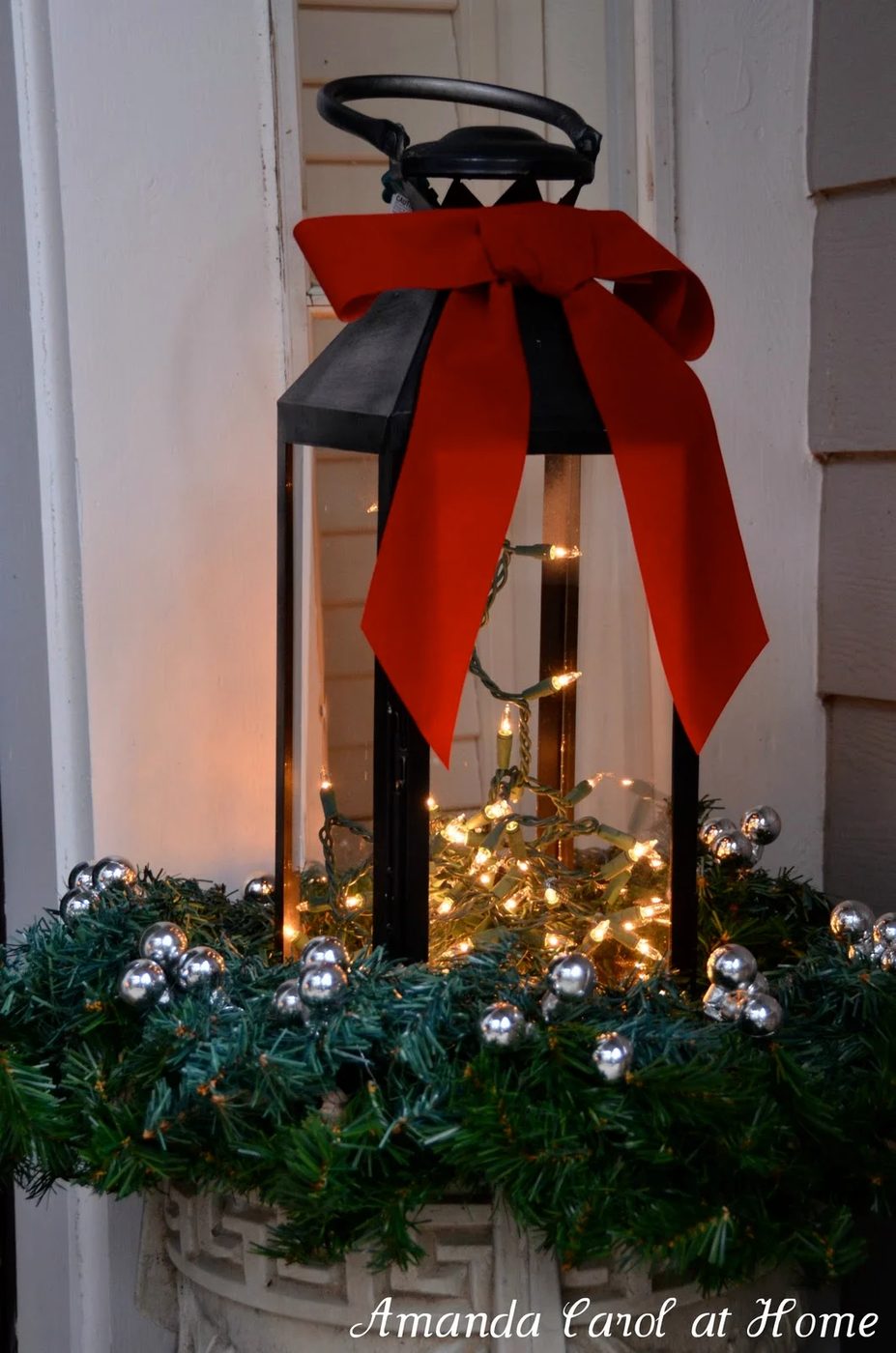 lantern in outdoor planter for winter, Amanda Carol at Home via @Bekob