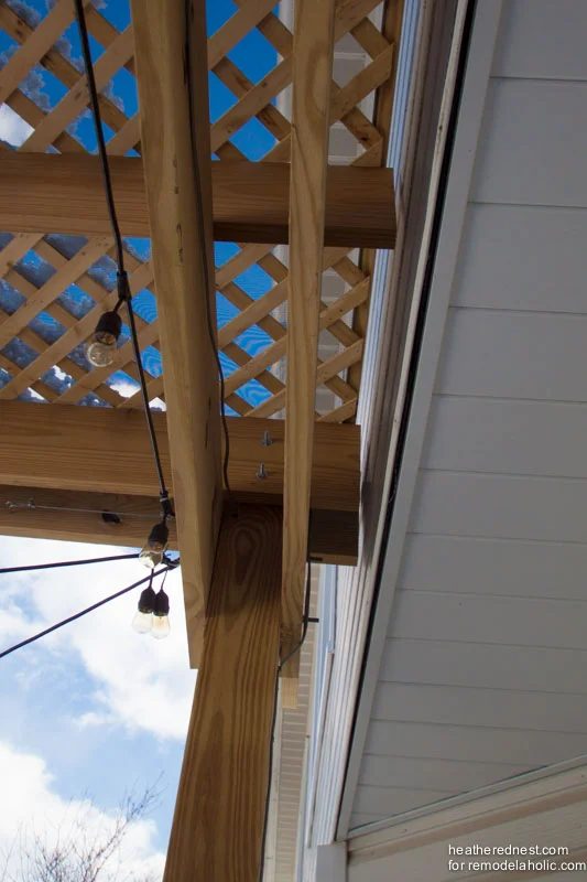 striking direct Handmade deck pergola on an existing deck, full how-to and walkthrough from The Heathered Nest on Bekob.com