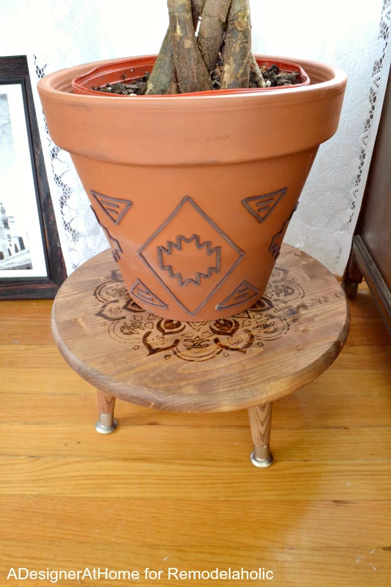 straightforward Handmade style! Handmade suede planter, plus a wood-burned planter stand/ottoman