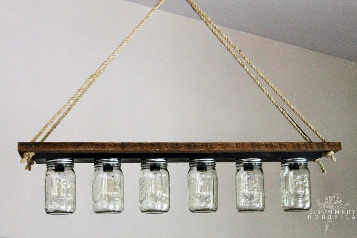 mason jar pendant chandelier light from bathroom vanity light strip - The Summery Umbrella featured on @Bekob