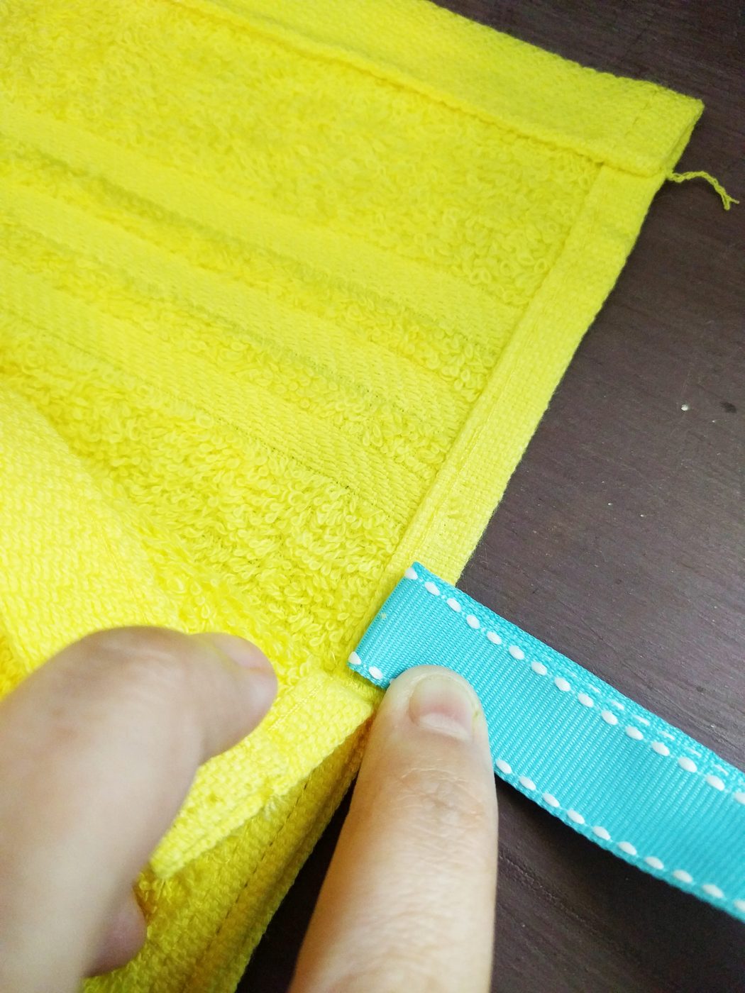 placing the tie on a shower carrying case