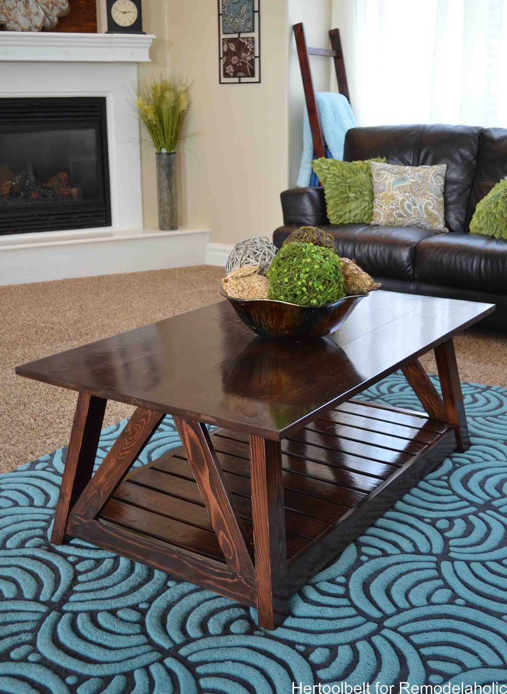 Inspired by a coffee table in a HGTV dream home. I love the trapezoid base and slats that make up this table. Handmade slat coffee table with free plans.