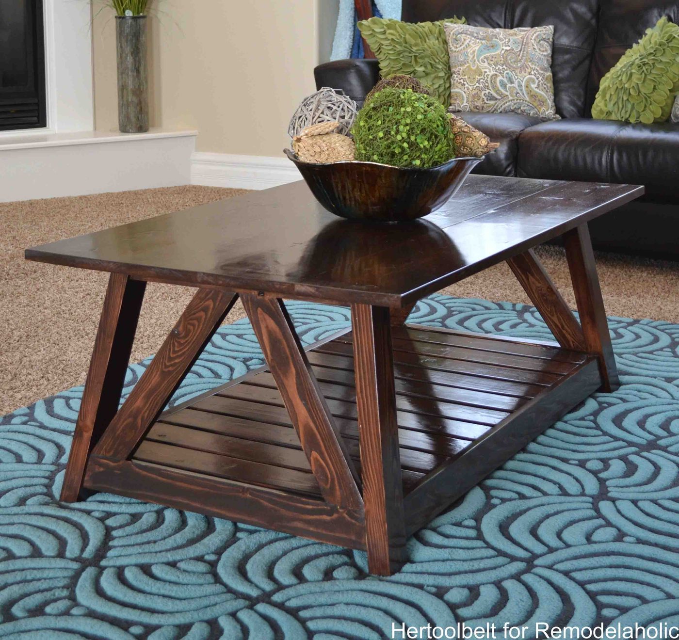 Inspired by a coffee table in a HGTV dream home. I love the trapezoid base and slats that make up this table. Handmade slat coffee table with free plans.