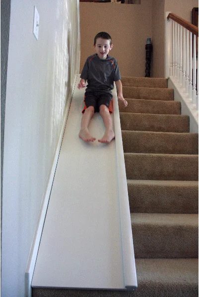 See how to build your own stair slide for hours of fun! This sturdy wood slide is easily removable so you can slide when you want and have the full stairs when you need. Get the fu