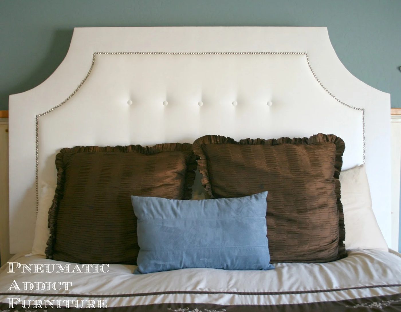 build a handmade tufted headboard with nailhead trim