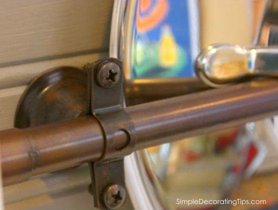 Ingenious pot lid storage using copper plumbing pipes in open shelving kitchen redo by direct Decorating Tips featured on @Bekob