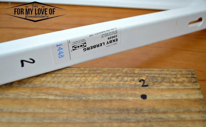 mark onto the cut lumber where youll need to go back and screw wood screws into by placing bracket onto wood and mark at the end of the groove
