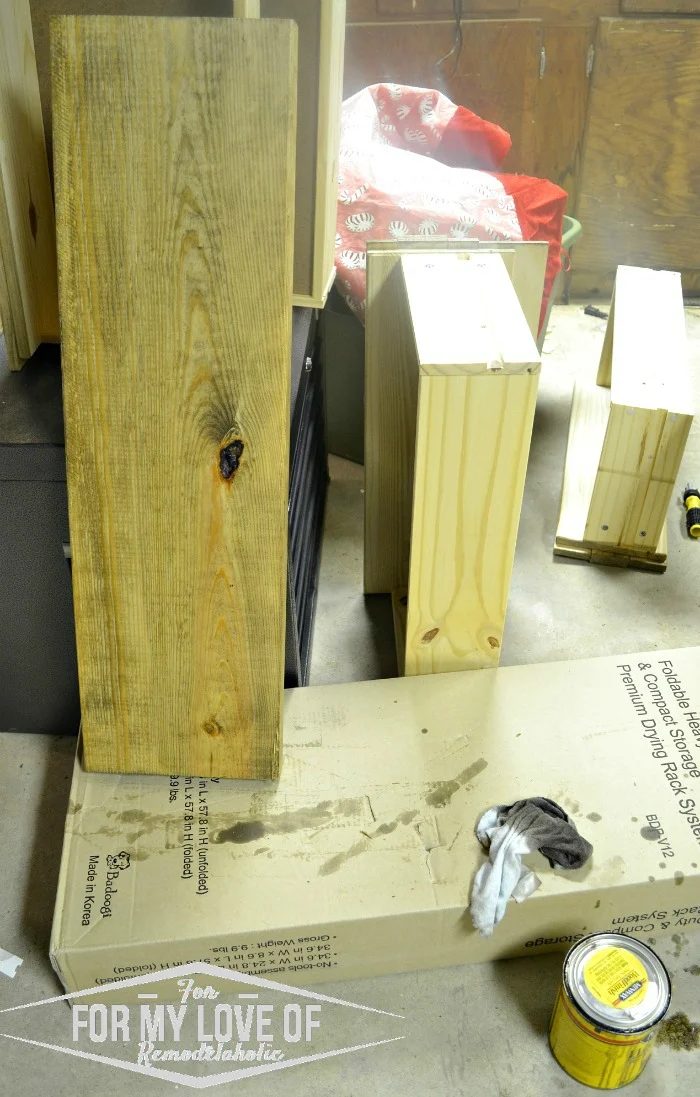 stain fresh cut lumber with choice of stain before marking holes for brackets fresh lumbar for rustic modern boho shelves