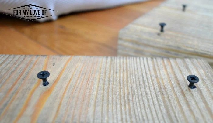 use the drill and phillips drill bit to screw the wood screws most of the way into the wood leaving enough of a gap to slide the brackets into place