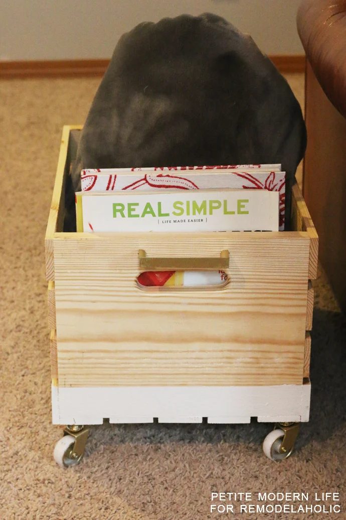 A striking multi-purpose display box with gold accents that's ideal for magazines, blankets, and toys!