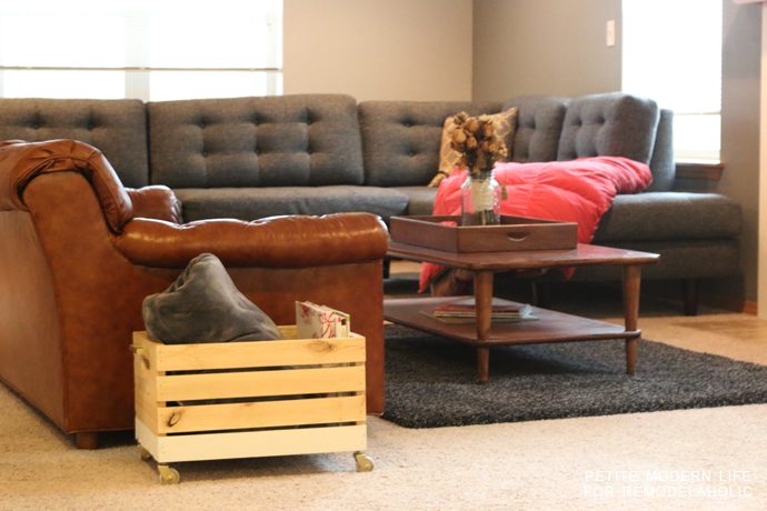 A striking multi-purpose display box with gold accents that's ideal for magazines, blankets, and toys!