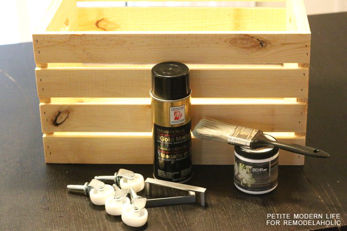 A striking multi-purpose display box with gold accents that's ideal for magazines, blankets, and toys!