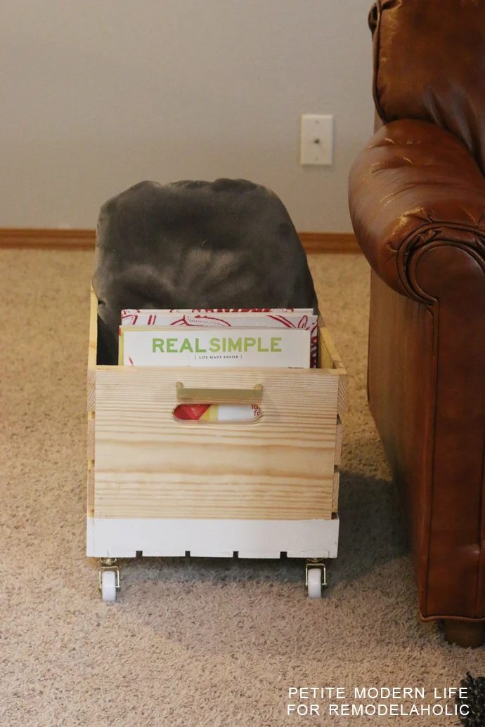 A striking multi-purpose display box with gold accents that's ideal for magazines, blankets, and toys!