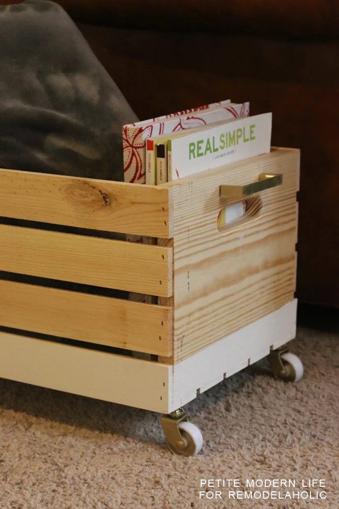 A striking multi-purpose display box with gold accents that's ideal for magazines, blankets, and toys!