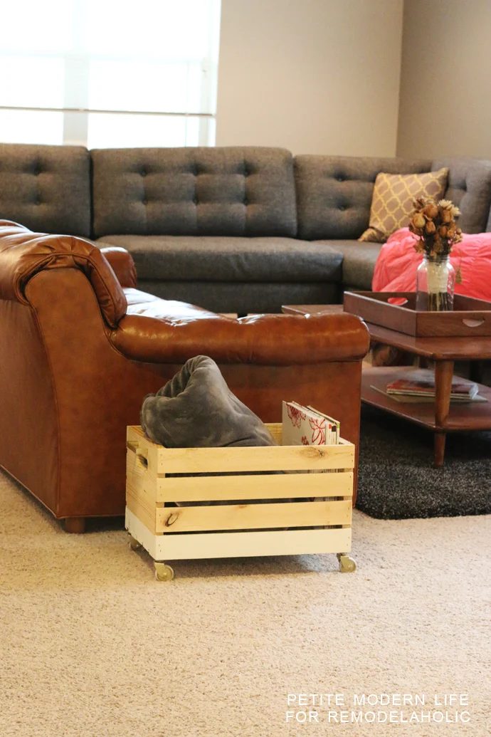 A striking multi-purpose display box with gold accents that's ideal for magazines, blankets, and toys!