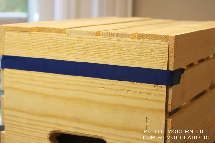 A striking multi-purpose display box with gold accents that's ideal for magazines, blankets, and toys!