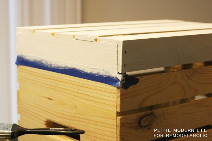 A striking multi-purpose display box with gold accents that's ideal for magazines, blankets, and toys!