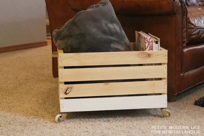 A striking multi-purpose display box with gold accents that's ideal for magazines, blankets, and toys!