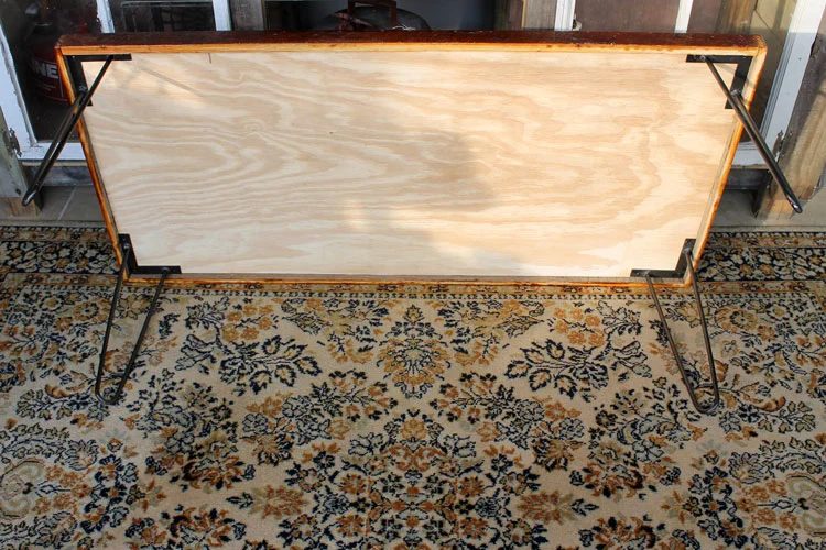 Attaching the hairpin legs to the bottom of the coffee table