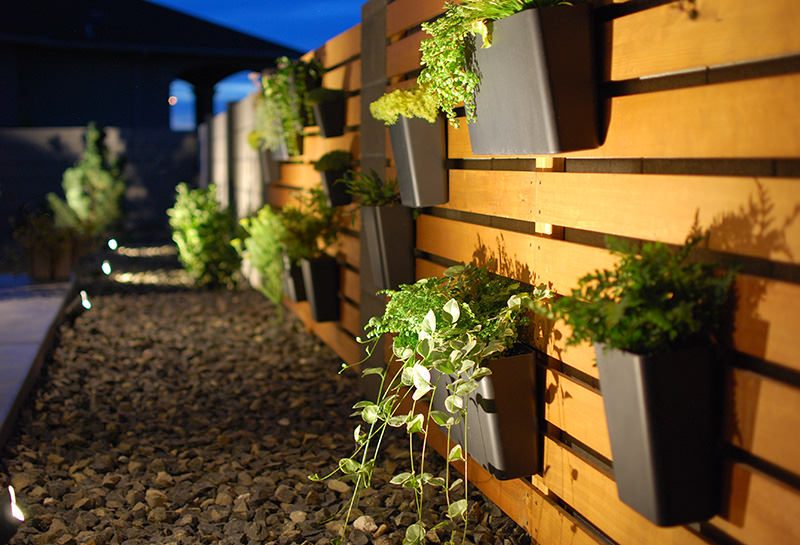 Handmade Modern Wood Slat Garden Wall With Hanging Planters And Spotlights, The Garden Glove Featured On Bekob