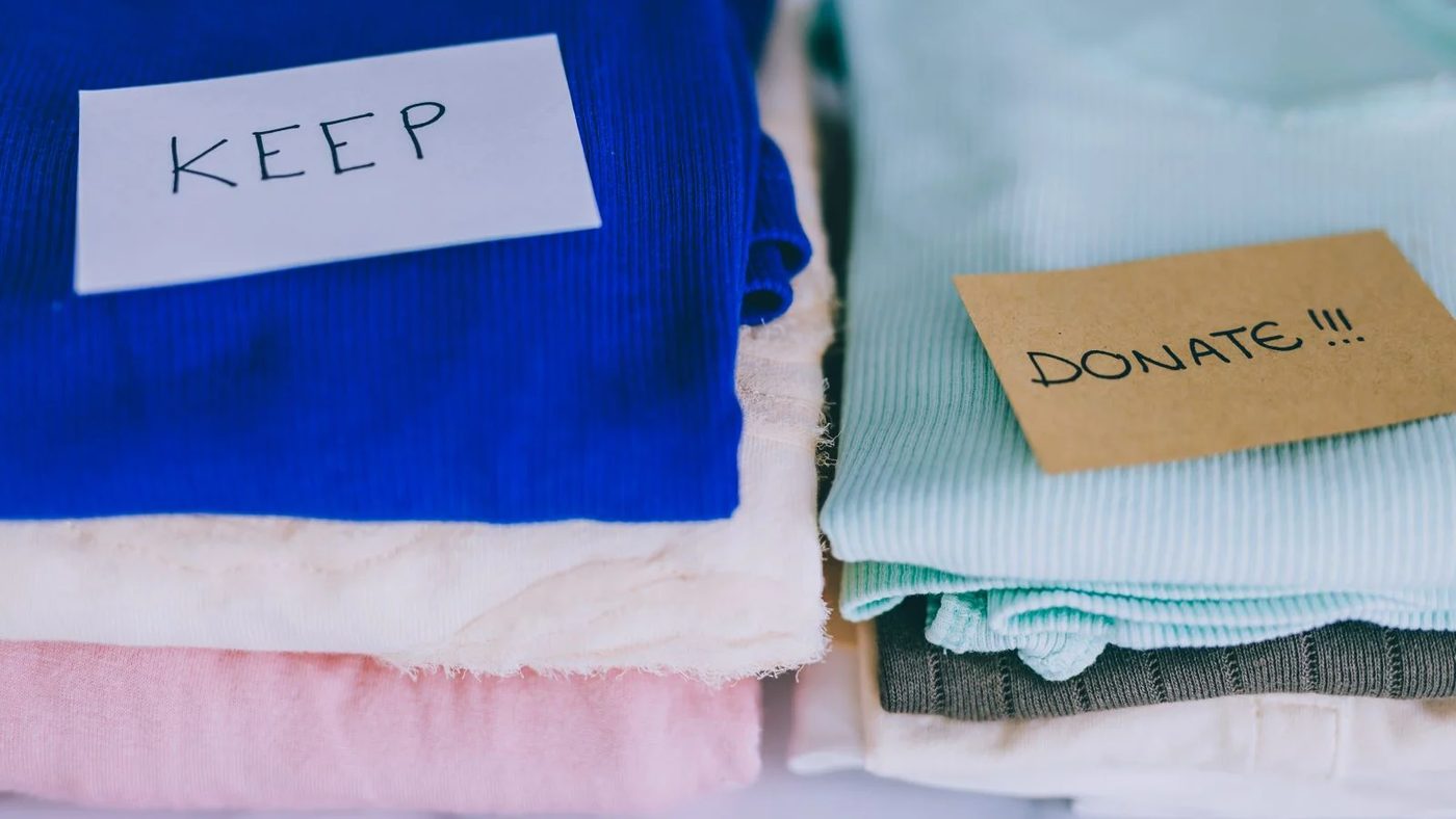 Declutter Closet Keep Donate Pile Shutterstock