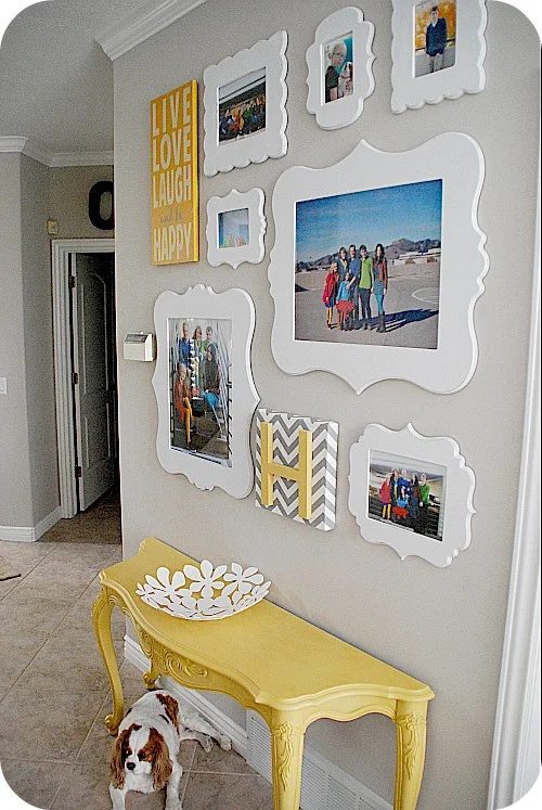half console table with family photo gallery wall, Tatertots and Jello via Bekob