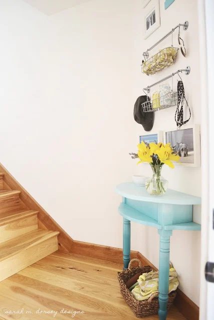 half console table with organized entryway gallery wall, Sarah M Dorsey Designs via Bekob