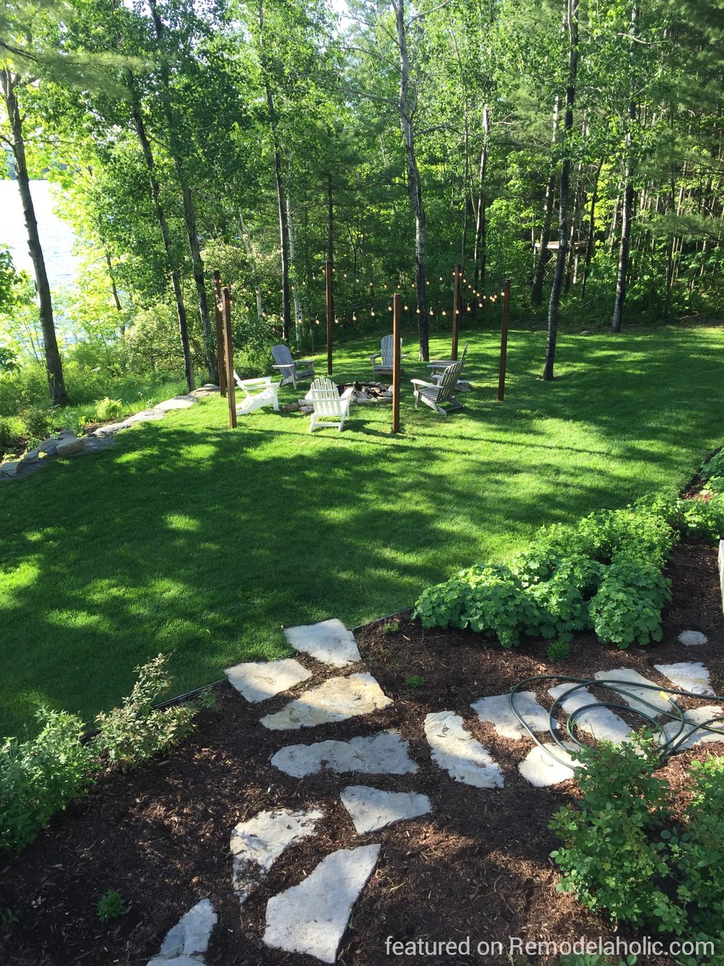 striking and direct Handmade fire pit area with string lights on posts, featured on @Bekob wm