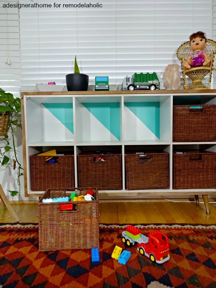 a modified cube organizer made to fit in with other furniture and look better