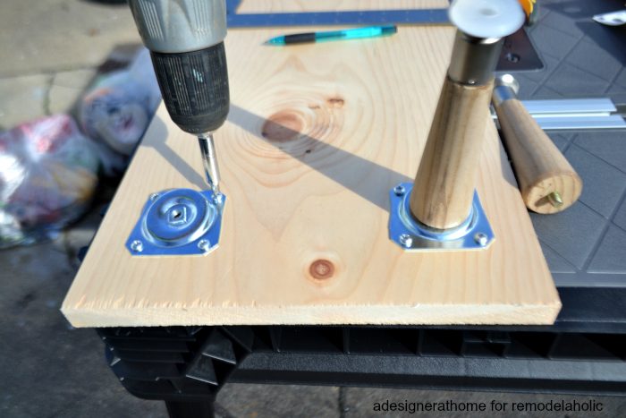 align furniture leg plates with pre marked holes and screw into place using a drill