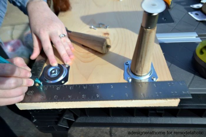 adesigner at home for Bekob marking screw holes for furniture leg plates