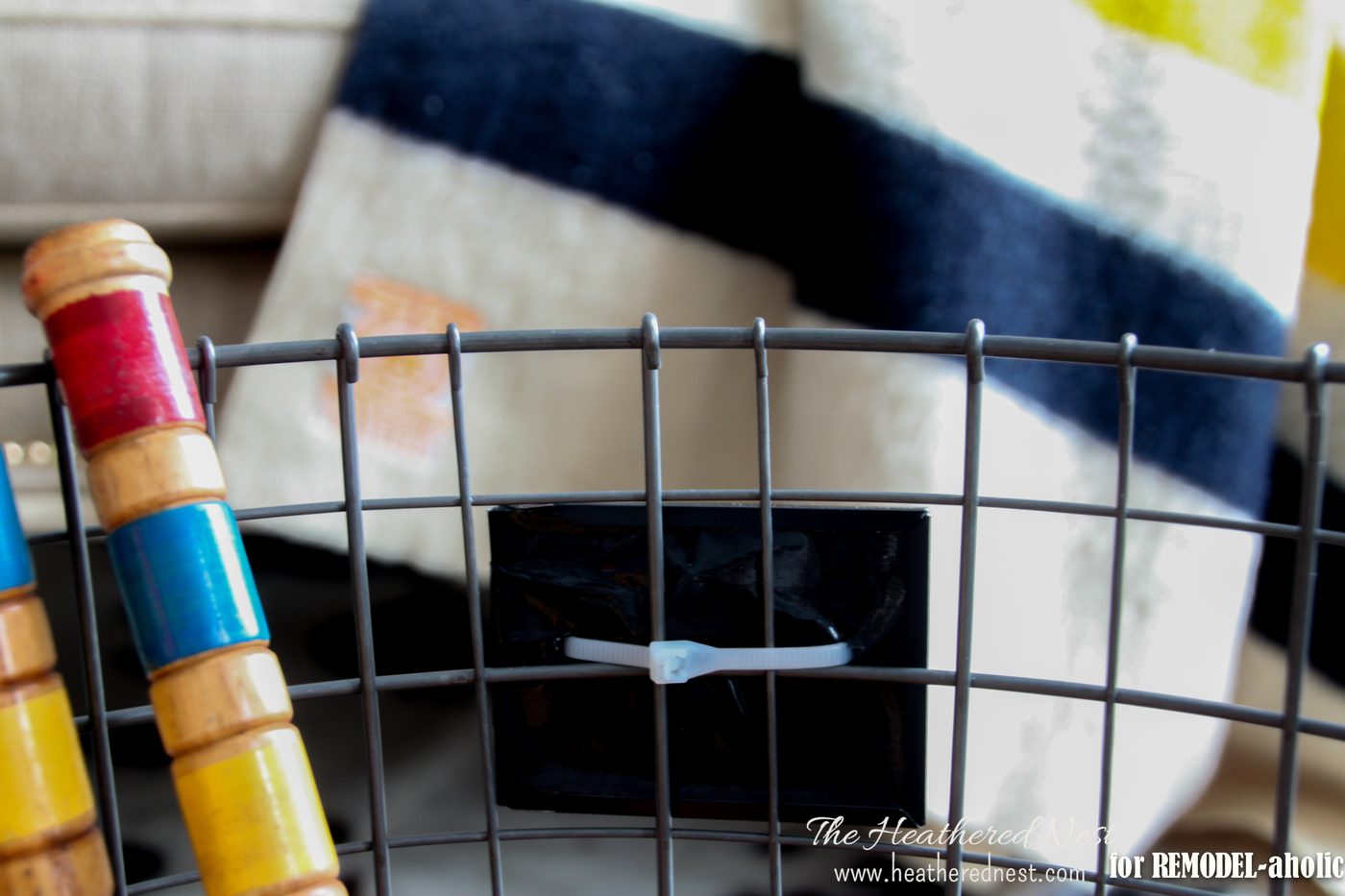 use a rolling wire basket to organize sports gear and toys - The Heathered Nest on @Bekob