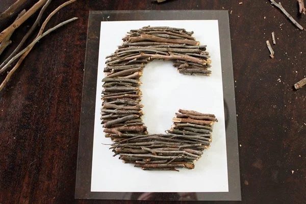 straightforward Art options for Kids Room Decor: handmade stick monogram letters for kids (Hello Little House)