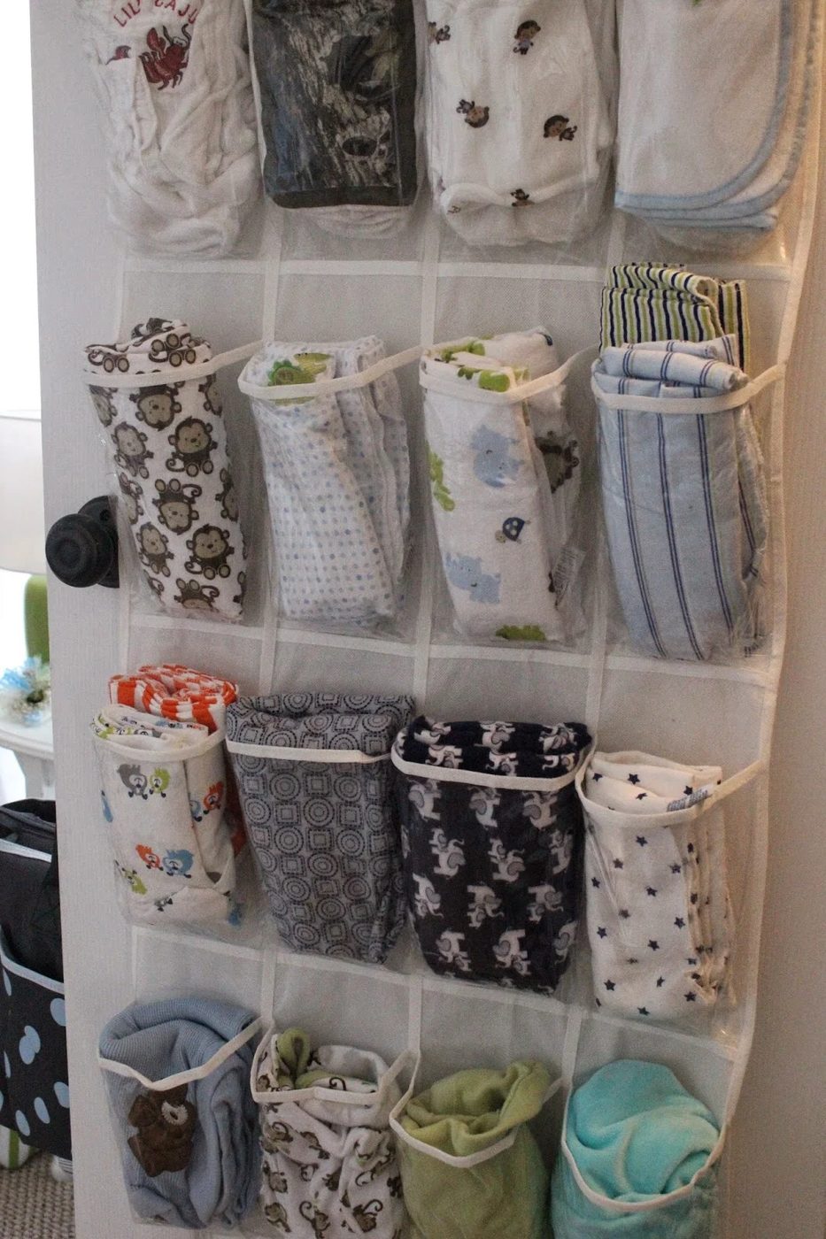 Store baby blankets and/or burp cloths in a shoe organizer on the back of the door. Why did I not think of that?!?