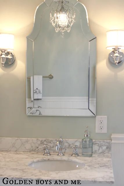 vivid shaped mirror in an elegant master bath, featured on Bekob.com