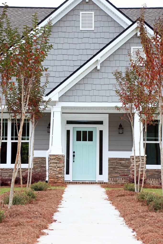 Exterior Paint Colors that Increase Curb Appeal | Exterior color is SW Dovetail and door color is SW Waterscape | More info on Bekob.com