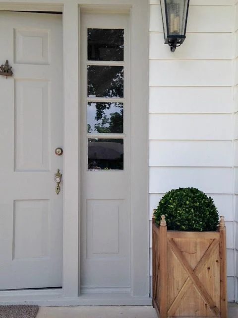 Exterior Paint Colors that Increase Curb Appeal | Siding is SW Pure White and Door Color is SW Dorian Gray.