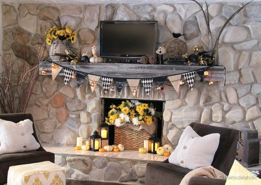 Mantel Decor With Garland Pumpkins, Candles And Flowers