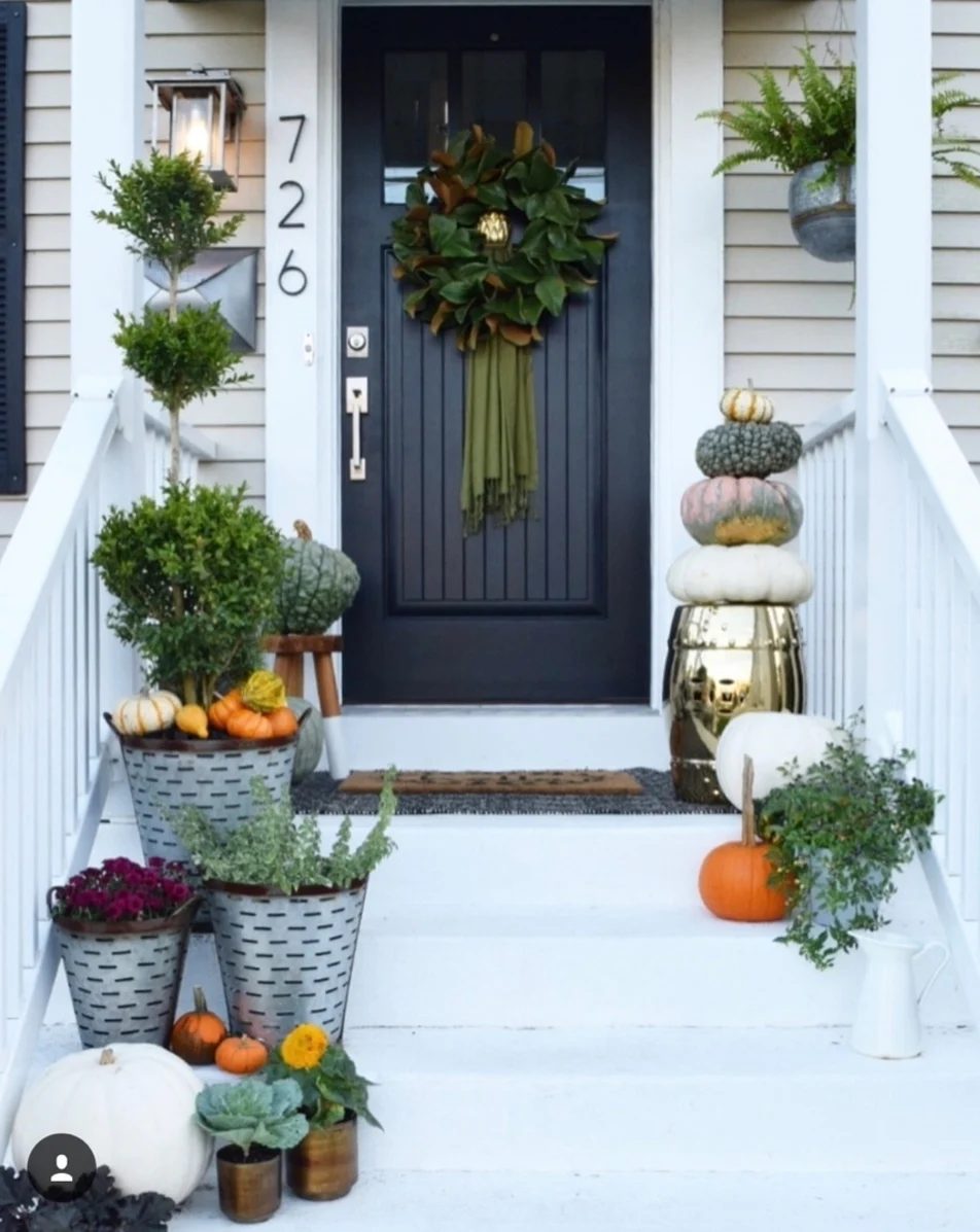 Fall Front Porch, Black Door With Green Wreath, Metal Flower Pots With Pumpkins And Green Plants