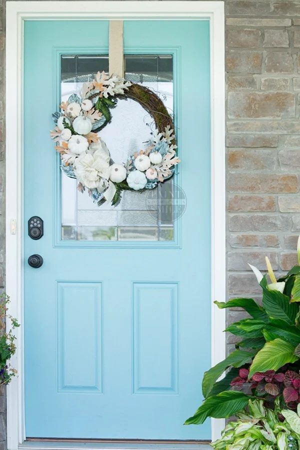 Egg Shell Blue Door With White Pumpkin, Blue And Orange Floral Wreath