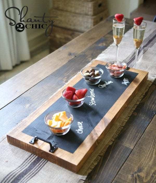 Wood Table With Burlap Table Runner And Wood Serving Tray With Chalkboard Top Where You Can Label Food Being Served