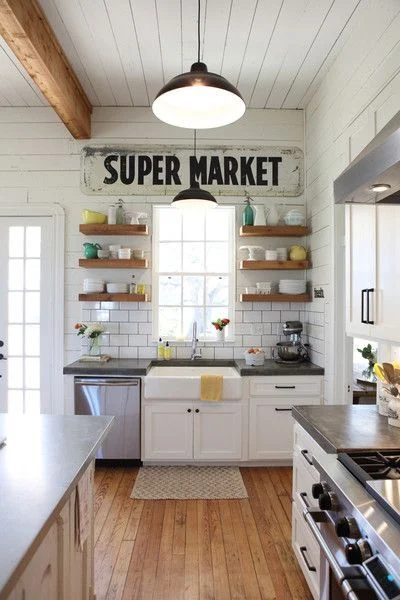 Farmhouse Kitchen Inspiration -- wood floating shelves on either side of the sink, well fitted! And are those concrete countertops, too?