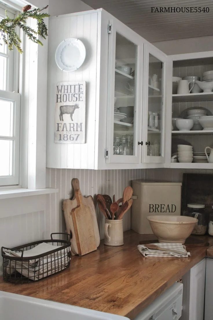 Farmhouse Kitchen Inspiration -- wood counterops, white cabinets with glass doors for display