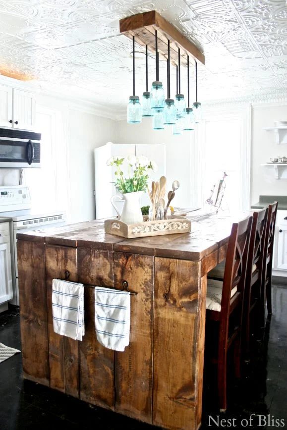 Farmhouse Kitchen Inspiration - this chunky wood island is memorable! And the ceiling!