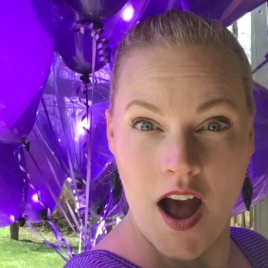 Cassity In Front Of Purple Balloons