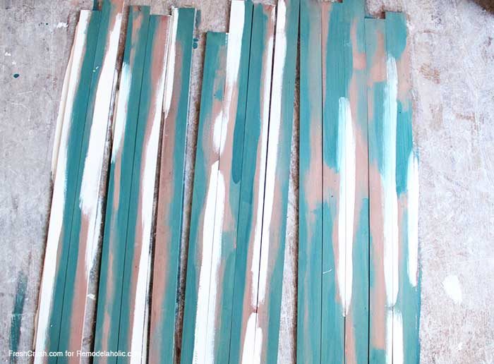 how to stain and paint faux barn boards for furniture and decor -- stain, paint, and then sand!