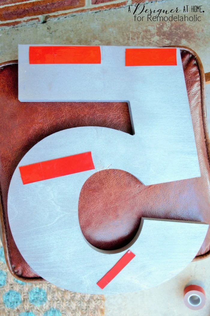 using heavy duty outdoor double sided tape to hang house numbers