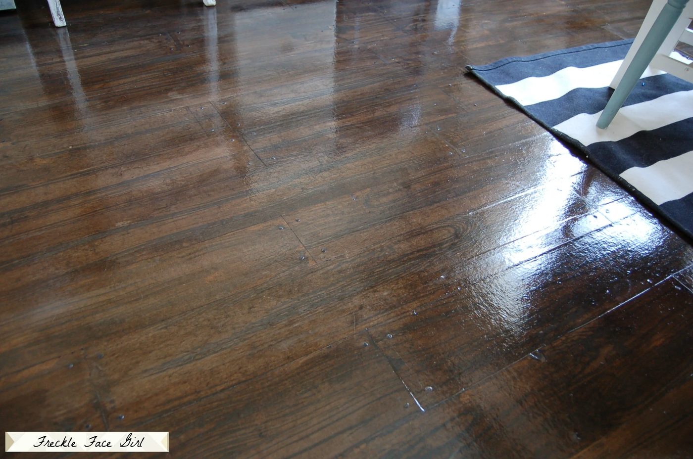 Handmade brown paper flooring, painted and stained faux wood plank flooring