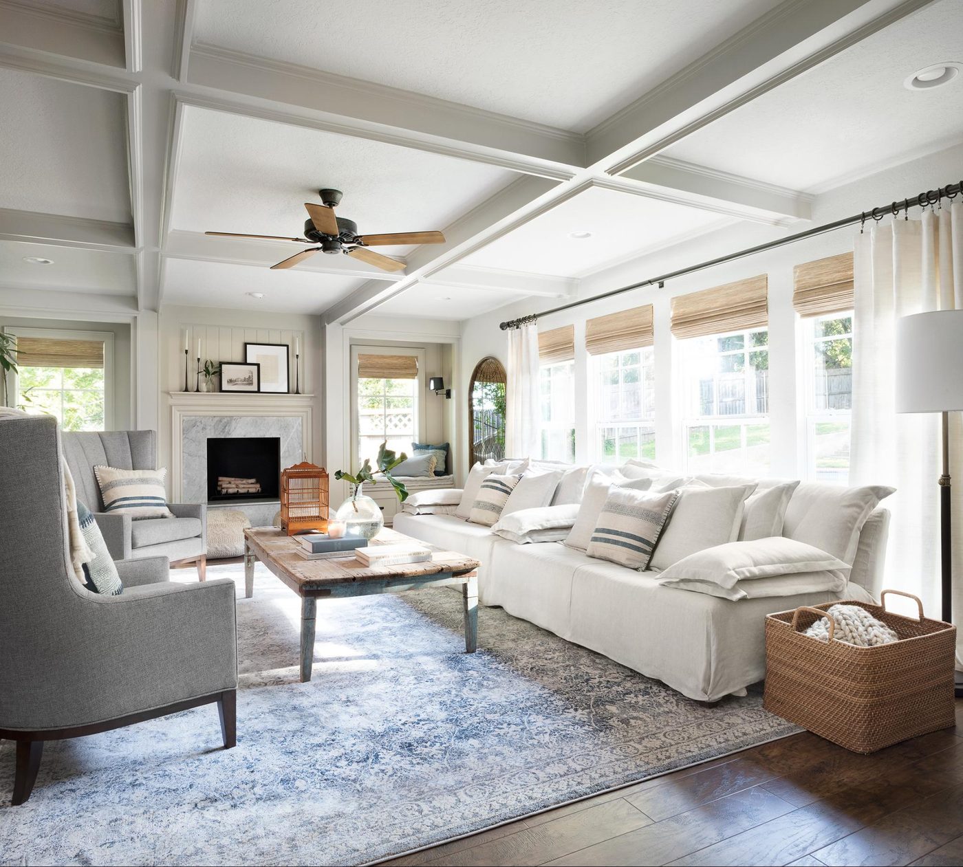 Fixer Upper Mountain House Living Room using neutrals and blue tones to create a modern traditional family room!