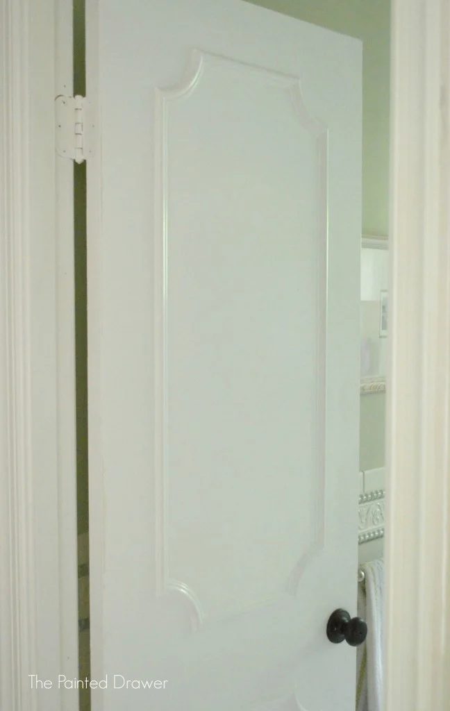 Upgrade a flat door with moulding by The Painted Drawer featured on @Bekob